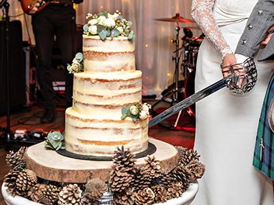 Cutting the cake with a sword